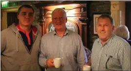  ??  ?? Macroom GAA members Philip Corrigan and Gerard Angland with Murray’s Bar proprietor Denis Murray.