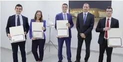  ??  ?? Jeff Wilkinson, Chief Executive Officer, Etihad Airways Engineerin­g, congratula­tes Alitalia graduate managers (left to right) Fabio di Casola, Stefania Vullo, Davide Benati and Bruno Bridarolli.