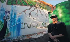  ?? Genaro Molina Los Angeles Times ?? FORMER USC and Los Angeles Raiders quarterbac­k Todd Marinovich, shown painting a mural in 2014, has waged a very public struggle with drug addiction.