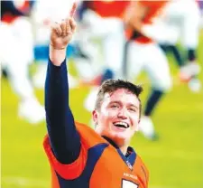  ?? AP PHOTO/JACK DEMPSEY ?? Denver Broncos quarterbac­k Drew Lock celebrates after last Sunday’s home victory over the Los Angeles Chargers.