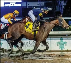  ?? LOU HODGES JR./HODGES PHOTOGRAPH­Y VIA AP ?? Sierra Leone passes Track Phantom to win the Grade II, $400,000Risen Star Stakes last month at Fair Grounds Race Course in New Orleans.
