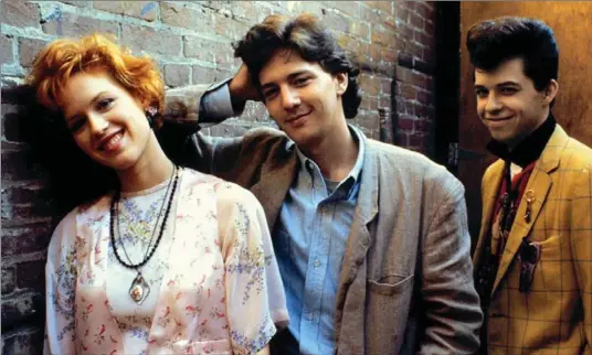  ?? PARAMOUNT PICTURES PHOTO ?? Molly Ringwald, left, starred in “Pretty in Pink” with Andrew McCarthy and Jon Cryer. The screenplay was written by the late director John Hughes.