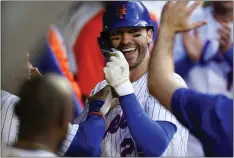 ?? FRANK FRANKLIN II – THE ASSOCIATED PRESS ?? Mets newcomer Tyler Naquin celebrates with teammates after homering in the second inning for his first of two longballs Thursday night against the Braves.