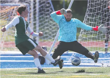  ?? DAN JANISSE ?? Ciaran O'connor of E.J. Lajeunesse is denied by Westview Freedom Academy goalkeeper Tyler Thompson during the WECSSAA A division senior boys final on Thursday. Lajeunesse captured the A title with a 4-1 victory in the game, with O'connor scoring one of the goals.