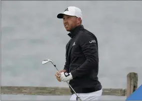  ?? ERIC RISBERG - THE ASSOCIATED PRESS ?? Daniel Berger follows his shot from the seventh tee of the Pebble Beach Golf Links during the final round of the AT&T Pebble Beach Pro-Am golf tournament Sunday, Feb. 14, 2021, in Pebble Beach, Calif.