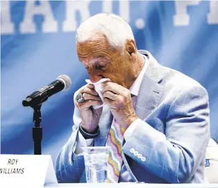  ?? GERRY BROOME/AP ?? Roy Williams shows his emotions after announcing his retirement as North Carolina’s coach Thursday in a news conference in Chapel Hill. In 33 seasons as a head coach, he won 903 games with UNC and Kansas, plus three NCAA crowns with the Tar Heels.