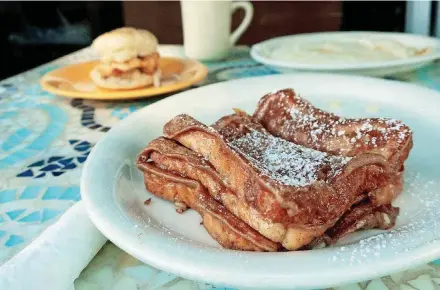  ?? [PHOTO BY ALEXANDRA MARVAR, FOR THE WASHINGTON POST] ?? French toast is a favorite at Narobia’s Grits &amp; Gravy in Savannah, Georgia.