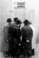  ?? Horst Eisefelder via WQED ?? Orthodox Jewish men gather on a street corner in Shanghai.