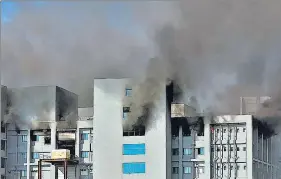  ?? AFP ?? Firefighte­rs try to control a fire that broke out at the Serum Institute, the world's largest maker of vaccines, in Pune on Thursday.