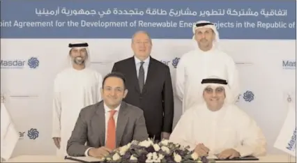  ?? -AP ?? Suhail bin Mohammed Faraj Faris Al Mazrouei, Armen Sarkissian, and Khaldoon Al Mubarak witnessing the signing ceremony by Mohamed Jameel Al Ramahi and David Papazian in UAE.