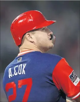  ?? Jae C. Hong Associated Press ?? MIKE TROUT wears a jersey bearing the name of his brother-in-law, Aaron Cox, on Friday in his return after a three-week absence and tripled in his first at-bat.