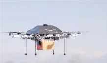  ?? GETTY IMAGES/ FILES ?? Online retailer Amazon is developing a remote aerial vehicle called Prime Air to deliver goods to customers.