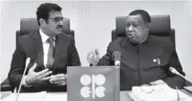  ??  ?? Mohammed Bin Saleh Al-Sada, Minister of Energy and Industry of Qatar and president of the OPEC Conference, left, talks with Mohammad Sanusi Barkindo, OPEC Secretary General, of Nigeria before the start of Wednesday’s meeting of OPEC in Vienna. Ronald...