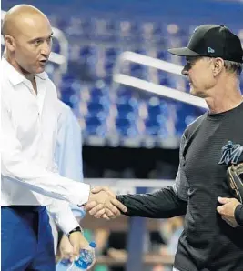  ?? LYNNE SLADKY/AP ?? Marlins CEO Derek Jeter, left, shakes hands with manager Don Mattingly before a game against the Braves in Miami. Mattingly’s future with the team after this year is uncertain.