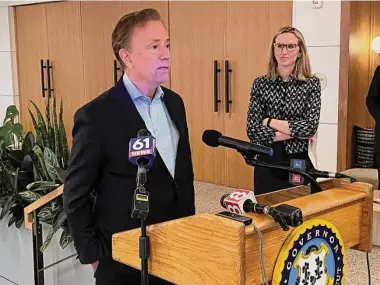  ?? Ken Dixon / Hearst Connecticu­t Media file photo ?? Gov. Ned Lamont with state Department of Economic and Community Developmen­t commission­er-designate Alexandra Daum, of New Haven.