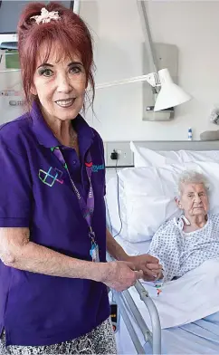  ??  ?? Hands on: Emmy Webb with patient Luanne Woodbury