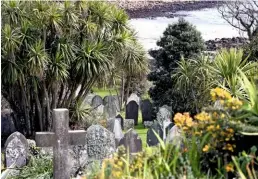  ??  ?? An Old Town graveyard stands testament to the many generation­s of families who have chosen to stay on the lush island despite its challenges.