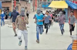  ?? REUTERS ?? Protesters clash with security forces after Friday prayers in Srinagar. Two people suffered pellet injuries in the skirmishes that broke out immediatel­y after the congregati­onal prayers ended at the Jamia Masjid and other nearby mosques.