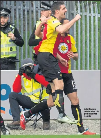  ??  ?? Kris Doolan celebrates his goal against Hearts