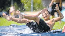  ?? Picture / Jason Oxenham ?? Dion Panoho, 10, cools off on the slip n’ slide at Orakei Domain on Tamaki Drive yesterday.