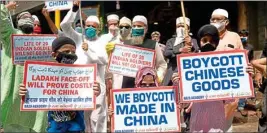  ??  ?? Protest against the Chinese government, in Mumbai, on Saturday