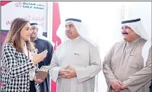  ??  ?? Salma Al-Hajjaj interactin­g with MGRP officials at the Career Fair.