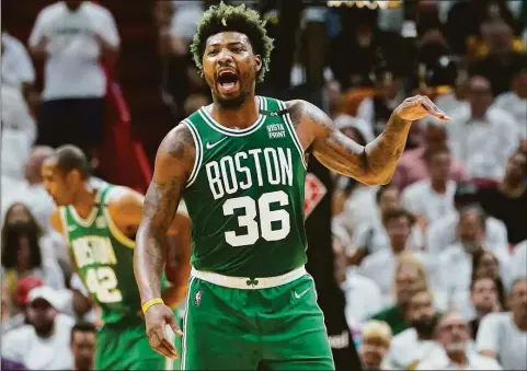  ?? Lynne Sladky / Associated Press ?? Celtics guard Marcus Smart gestures during Game 2 of their Eastern Conference finals series against the Heat on Thursday.