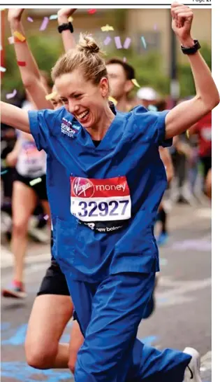  ??  ?? Uniform: Jessica Anderson in her scrubs passes marathon 21-mile mark