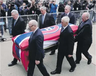  ?? THE CANADIAN PRESS ?? Guy Lafleur’s casket is carried into the church at the funeral service for the former Montreal Canadiens player in Montreal on Tuesday.