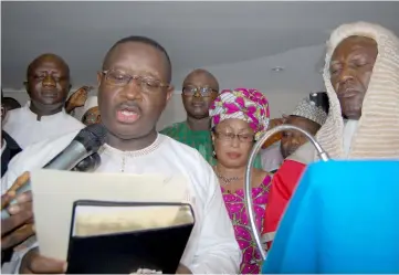  ??  ?? Bio (left) takes the oath of office as new president of Sierra Leone in Freetown. — AFP photo