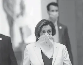  ?? NICHOLAS KAMM/ AFP VIA GETTY IMAGES ?? House Speaker Nancy Pelosi and other representa­tives leave the chamber Thursday after debating the relief package.