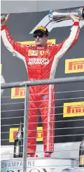  ??  ?? Red alert: Kimi Raikkonen celebrates his win