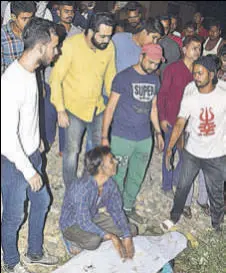  ?? SAMEER SEHGAL/HT ?? TRAGEDY ON TRACKS: A man cries near the body of his brother at the accident site in Amritsar on Friday.