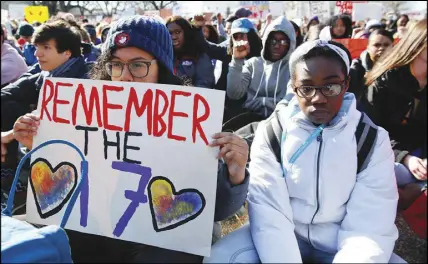  ?? AP PHOTO ?? in Students sit in silence as they rally front of the White House in Washington yesterday.