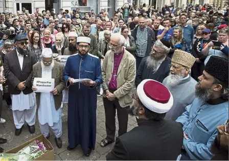  ?? — AFP ?? Standing together: Multi-faith leaders speaking at a gathering for the victims of the Manchester bombing, in St Ann’s Square in Manchester.