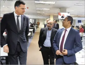  ??  ?? PRESS TOUR: French Ambassador Christophe Farnaud is shown the newsroom by regional executive editor Gasant Abarder. With them is Cape Argus editor Aziz Hartley (centre).