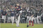  ?? [AP PHOTO] ?? The Boston Red Sox celebrate after winning the World Series against the Los Angeles Dodgers on Sunday in Los Angeles.