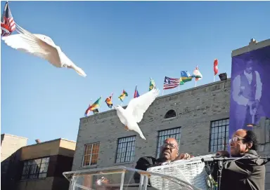  ??  ?? Doves are released outside Mason Temple to help kick off the 100th annual Holy Convocatio­n in November 2007. MIKE BROWN / THE COMMERCIAL APPEAL