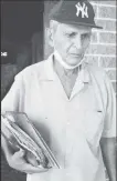  ??  ?? Dhanhiram Harcharan holding some of his documents which were retrieved from the debris.