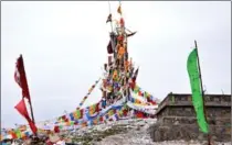  ??  ?? An arrangemen­t of prayer flags on a hill above Hezuo, capital of Gannan Tibetan Autonomous Prefecture.