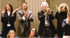  ?? | JEFF THOMPSON/ THE STATE JOURNAL- REGISTER ?? Gay rights supporters ( standing, from left) Rev. Jennifer Kottler, Rick Garcia, John Cepek and his wife, Charleen, applaud along with other supporters in the gallery after the Illinois House passed Senate Bill 3186 in January 2005.