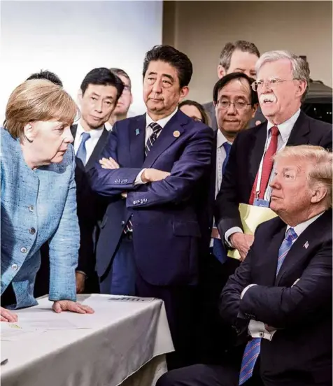  ?? (BUNDESREGI­ERUNG/JESCO DENZEL/HANDOUT VIA REUTERS) ?? Donald Trump au G7, face à la chancelièr­e allemande Angela Merkel.