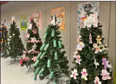  ?? ?? ‘Christmas Trees Around World’ display and scavenger hunt encouraged youngsters to learn about various countries’ holiday customs.