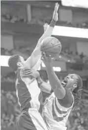  ?? Karen Warren / Houston Chronicle ?? Rockets center Nene, right, tries to find a way to score around the Lakers’ Larry Nance.