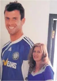  ??  ?? Gail Butcher with the portrait of her son at the Moss Rose