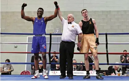  ?? Photo: ENGLAND BOXING ?? VICTORY: Army lightheavy­weight Carnell Brown gets the decision over Barrow’s Paul O’reilly