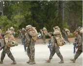  ?? TNS ?? Marines participat­e in a training march carrying during Marine Combat Training at Camp Lejeune, North Carolina.