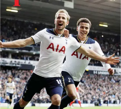  ??  ?? LONDON: Tottenham Hotspur’s Harry Kane, front, celebrates with Dele Alli after scoring a penalty during the English Premier League soccer match between Tottenham Hotspur and Arsenal at White Hart Lane. —AP