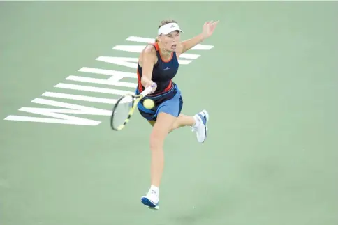  ?? — AFP photo ?? Caroline Wozniacki faced little resistance as she powered past Rebecca Peterson at the Wuhan Open.