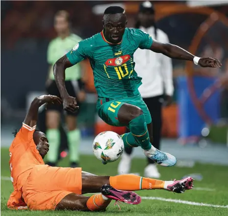 ?? AFP ?? Senegal’s Sadio Mane is challenged by Ivory Coast defender Odilon Kossounou during the Afcon last-16 match on Monday